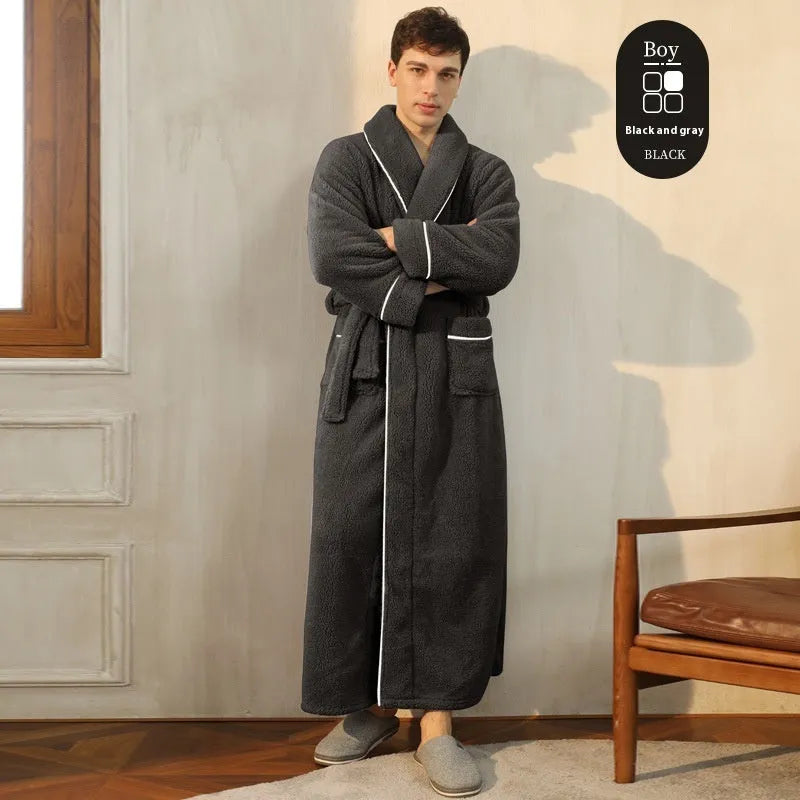 A man and woman wearing matching heavyweight navy blue flannel bathrobes, a couple's winter nightgown set.