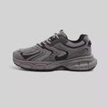 Men's gray platform casual sneakers with PU mesh upper and leather stitching details on a white background.