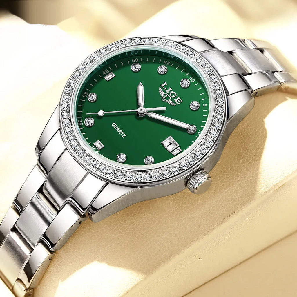 Silver fashion quartz watch with diamond bezel and 34mm stainless steel case on wrist.