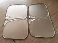 Titanium silver aluminium foil car sunshade folded, showing reflective surface and size options.