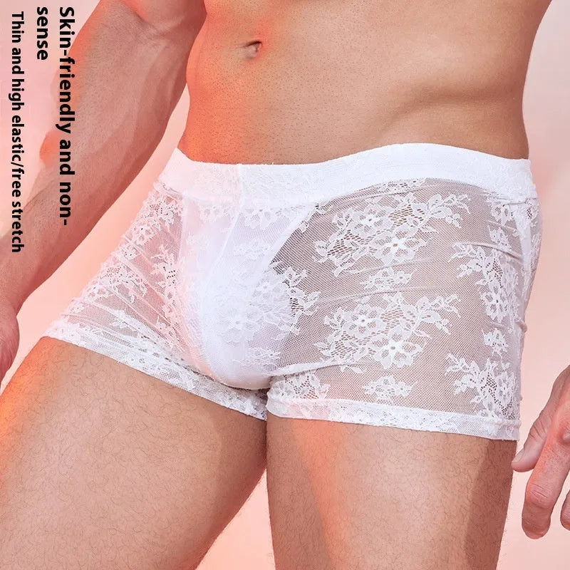 Men's black boxers with decorative lace fabric panels laid flat.
