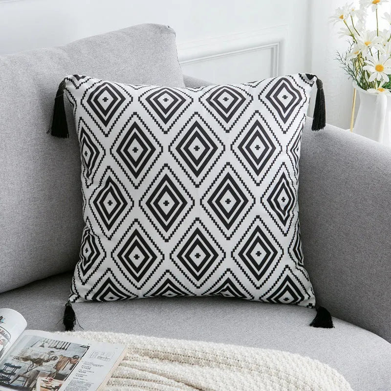 Bohemian national style polyester cushion cover in light grey on a sofa.