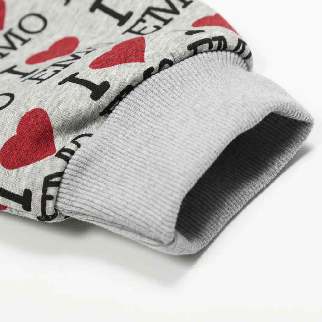 Women's melange grey cotton cardigan with autumn retro pattern, hood, and long sleeves laid flat.