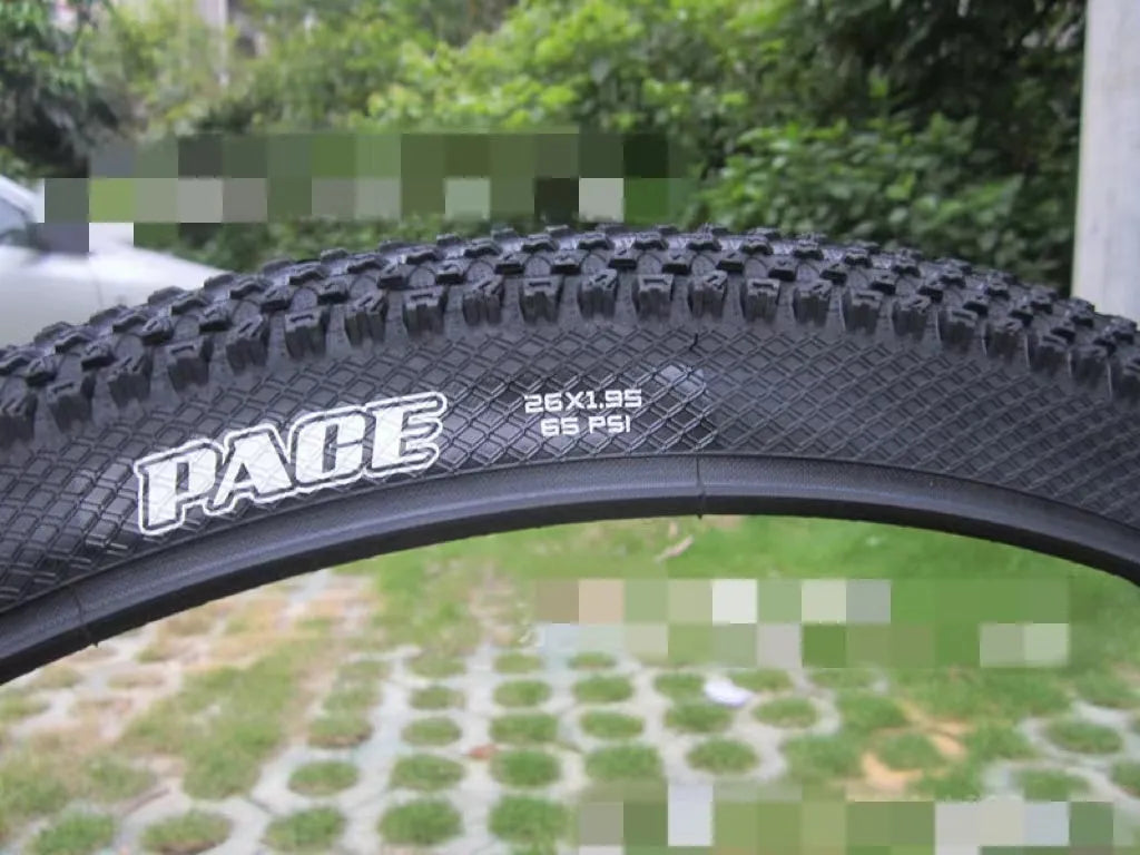 Ultralight black mountain bike tyre with white label option, showing tread pattern and size markings.
