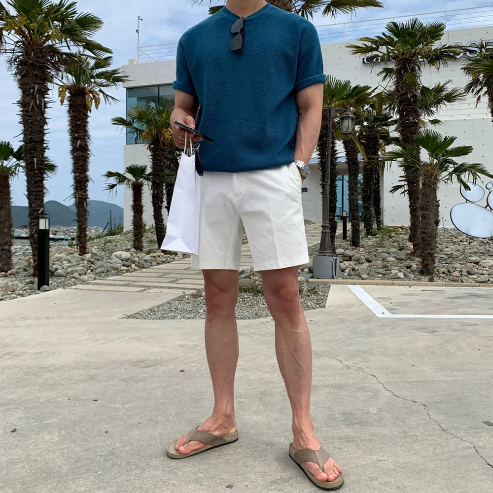 Men's straight-leg casual shorts in solid black, white, or khaki colour made from polyester fabric.