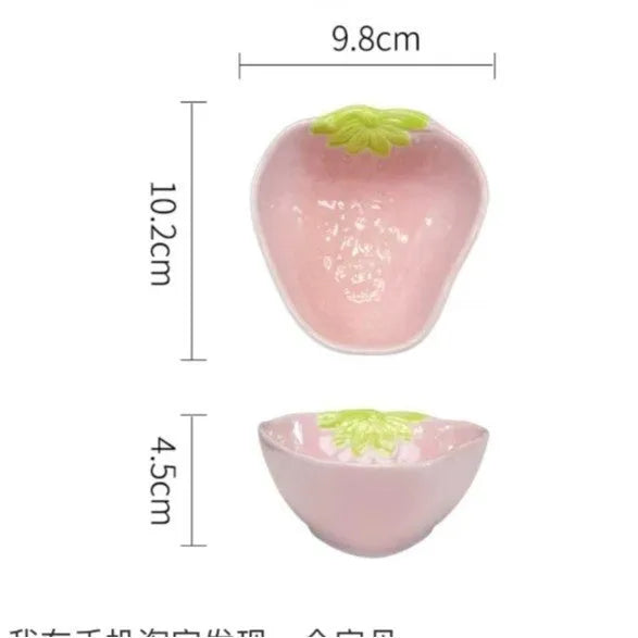 Creative strawberry-themed porcelain dinnerware set with fish plate, flower bowls, and straw hat plate.