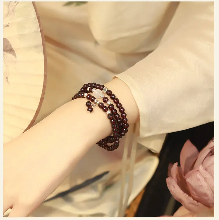 Antique style Chinese bracelet with U-shaped design and floral red garnet imitation gemstones