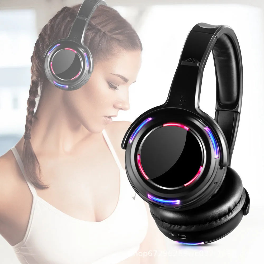 Black silent disco wireless headphones with a 3.5mm plug and long cable.