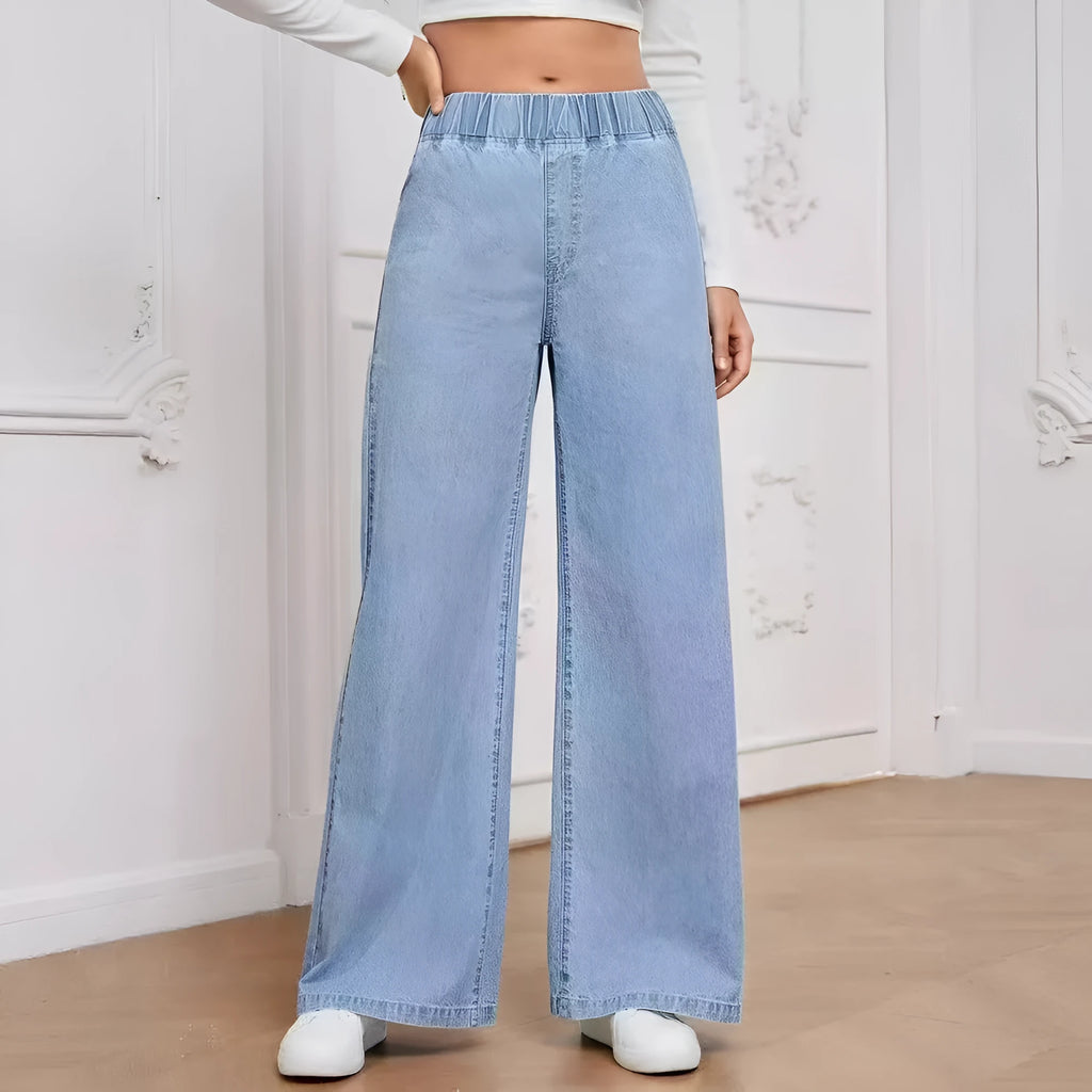 Light blue washed wide-leg denim trousers on a hanger, showing straight cut and mid-rise waist.