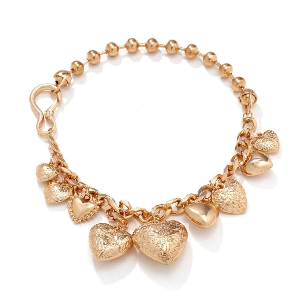 Exaggerated carved heart-shaped alloy pendant necklace on an adjustable metal chain.