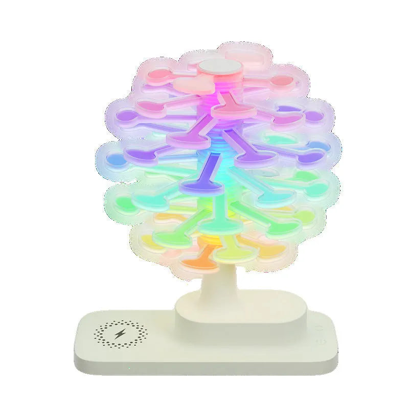Spiral tree geometric LED table lamp with white lighting on wooden surface