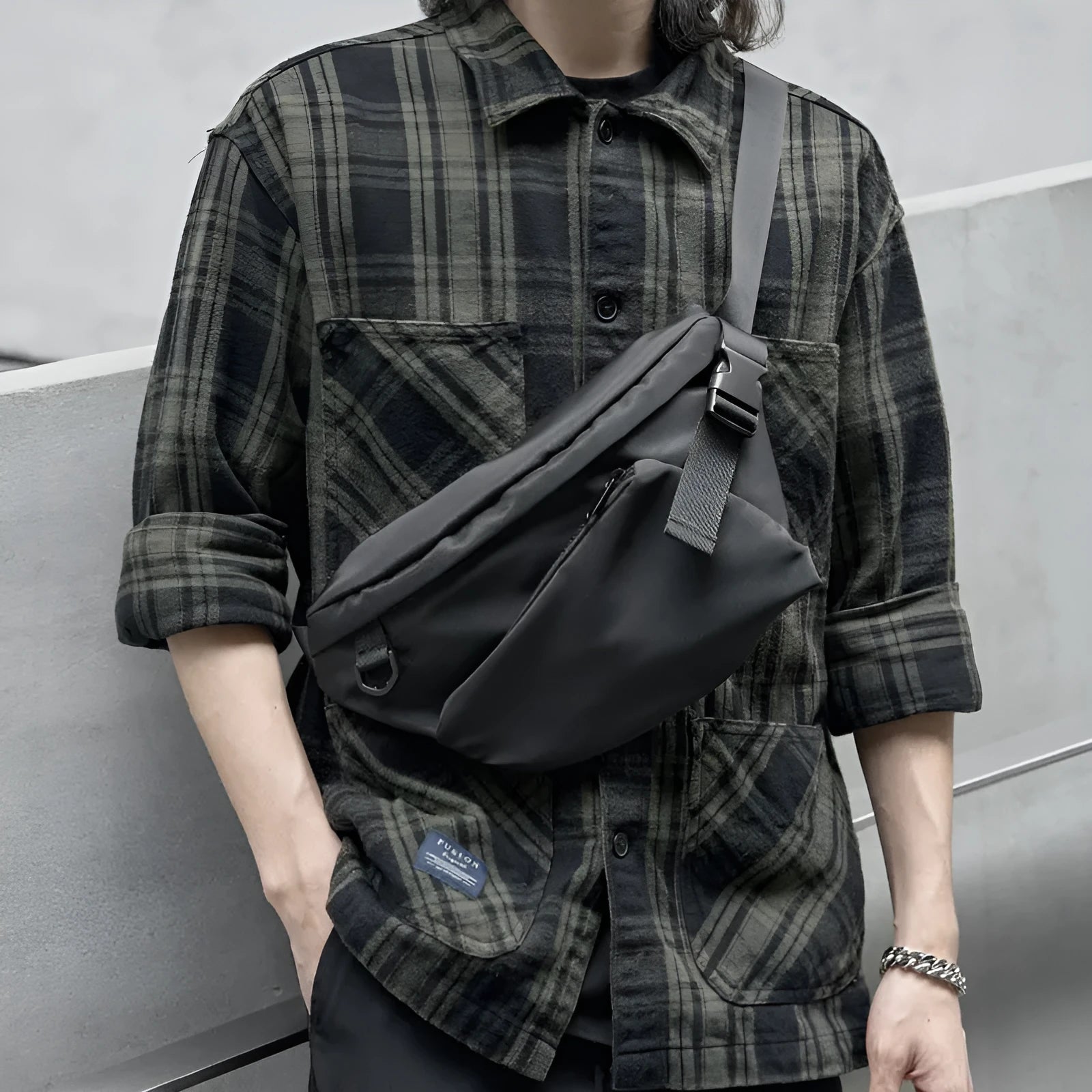 Black men's slanted chest bag made from Oxford fabric with sewing line details