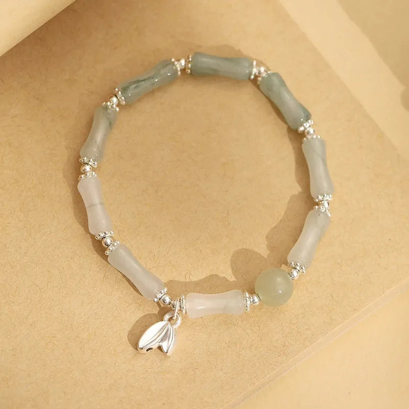 Women's antique style bracelet made from Tianshan green bamboo and sterling silver with bamboo joint detailing