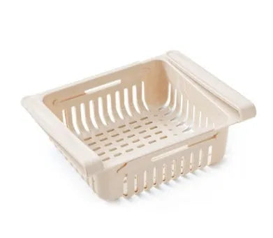 Blue telescopic plastic storage basket for refrigerator organisation with fruits and vegetables inside.