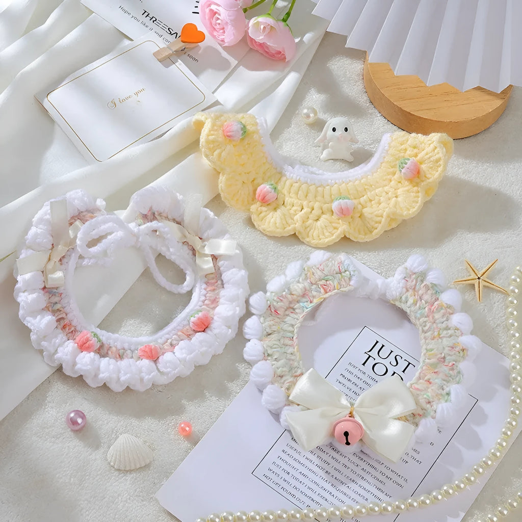 Handmade woven wool cat collar with embroidered cartoon British Shorthair kitten in pink, white, and yellow colours.