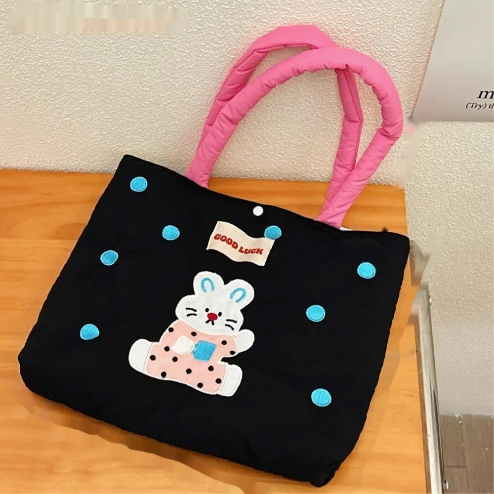 Cartoon print canvas handbag showing colourful design with 30x36x24cm dimensions