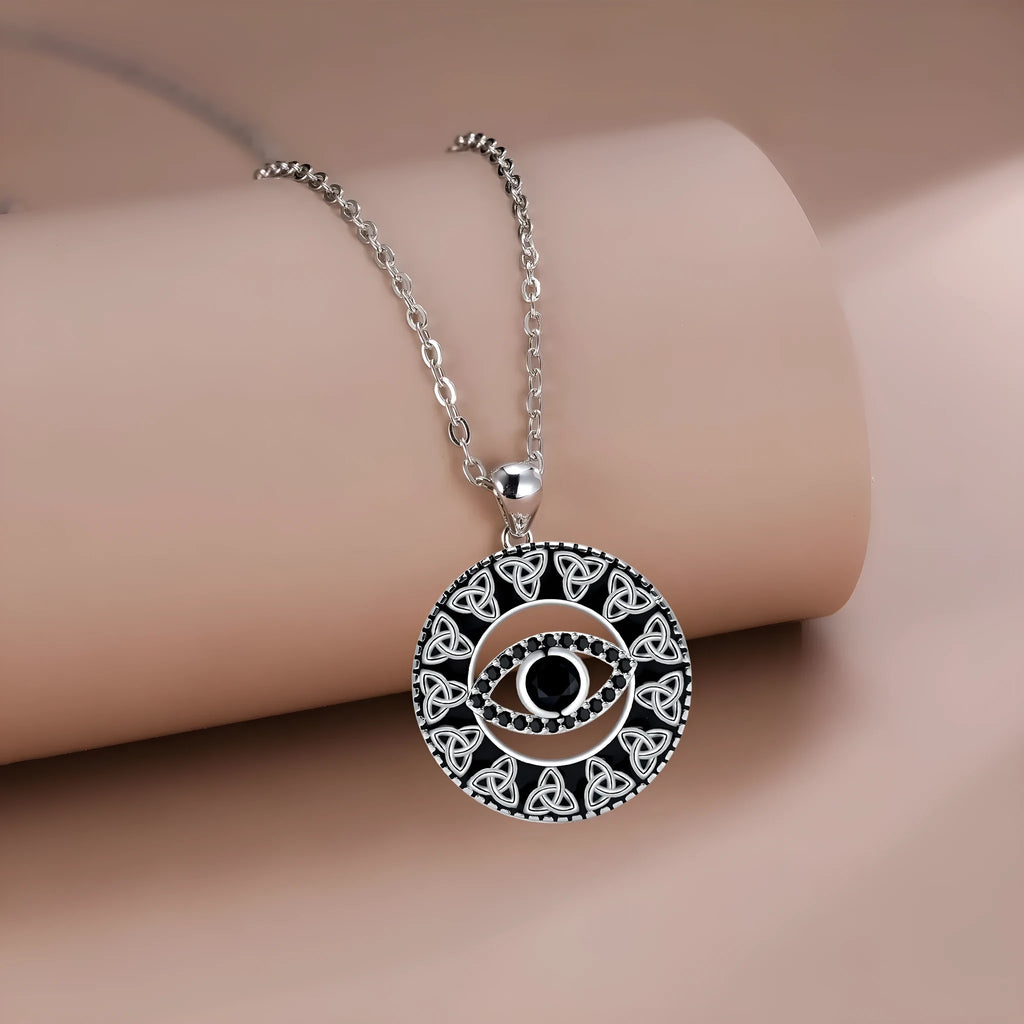 Copper Devil's Eye pendant necklace with a cross chain style on a person or mannequin.
