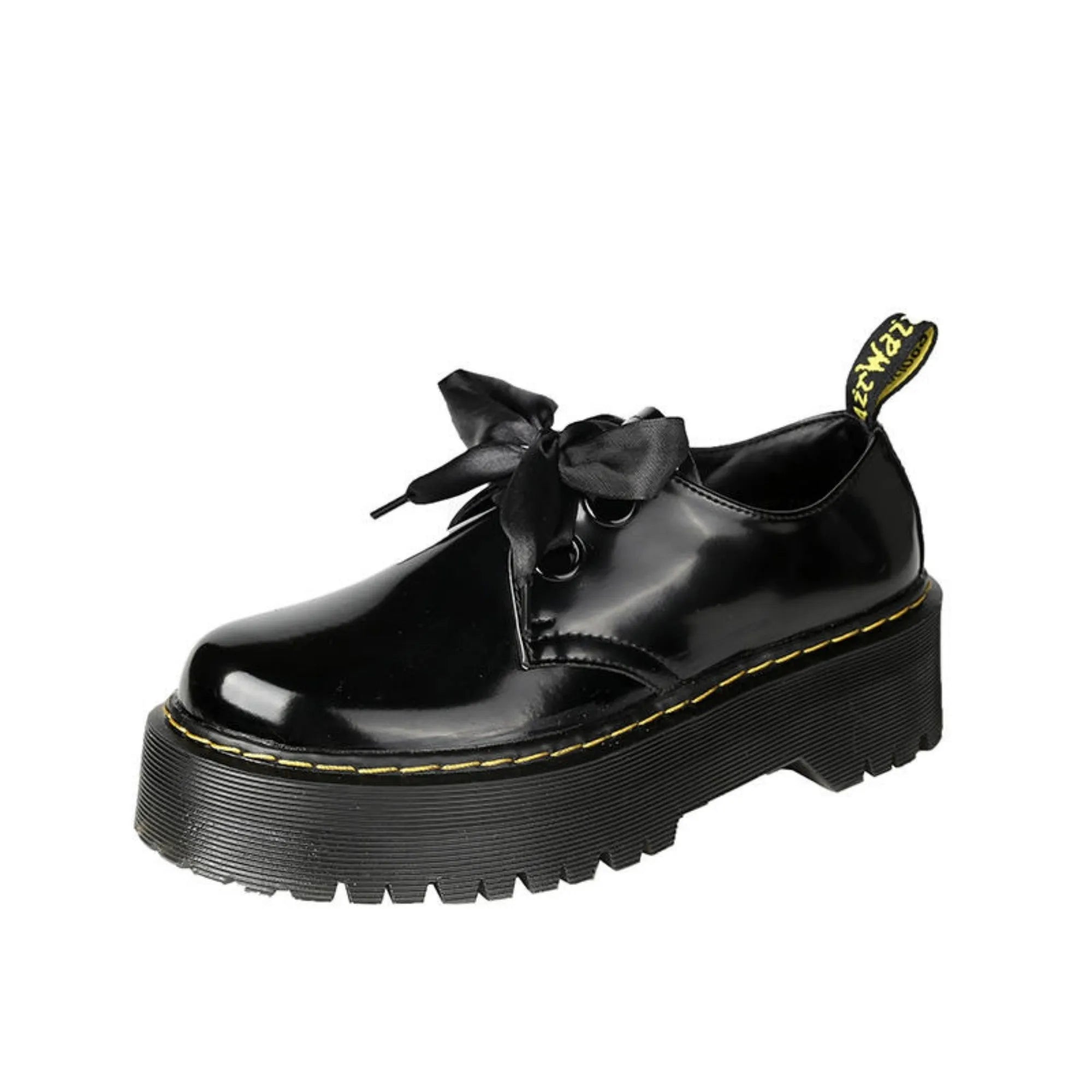 Women's white and black thick soled lace-up shoes with ribbon cross-straps on a superfine fibre upper.