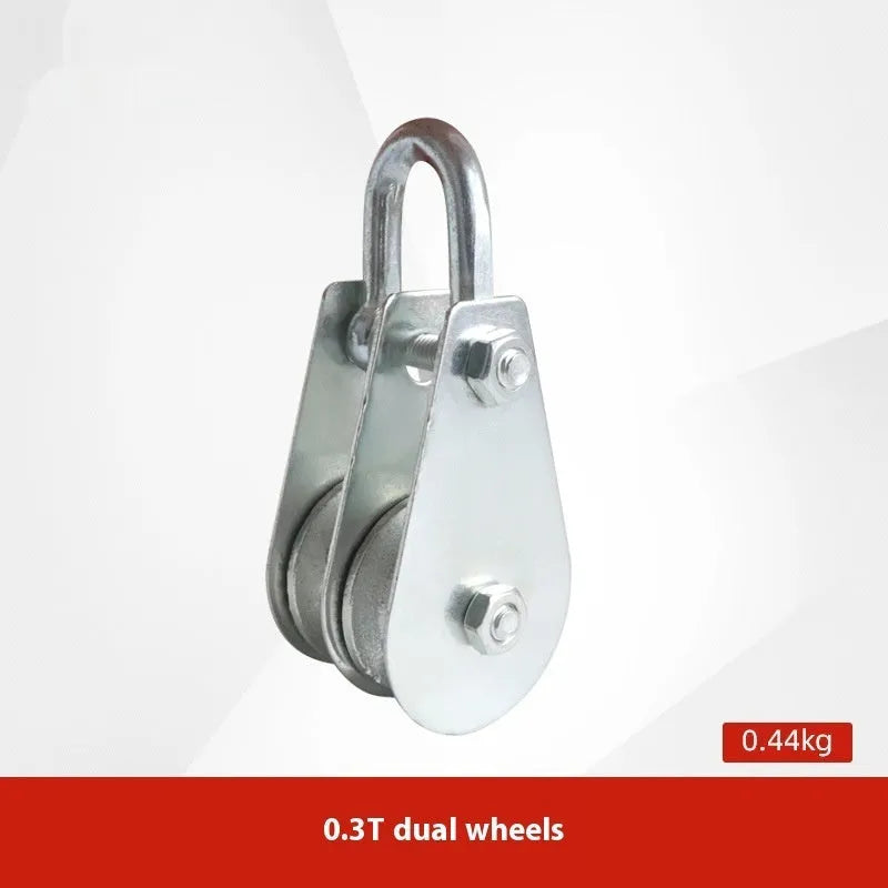 Red industrial steel lifting pulley with a safety latch on the hook for secure lifting.