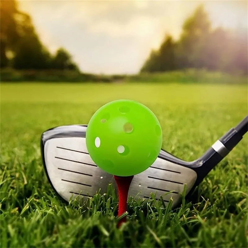 Multi-colour golf practice balls in red, orange, blue, green, white, and yellow shown in a net bag.