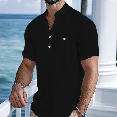 Man wearing a light blue stand collar linen blend t-shirt with short sleeves and a loose fit.
