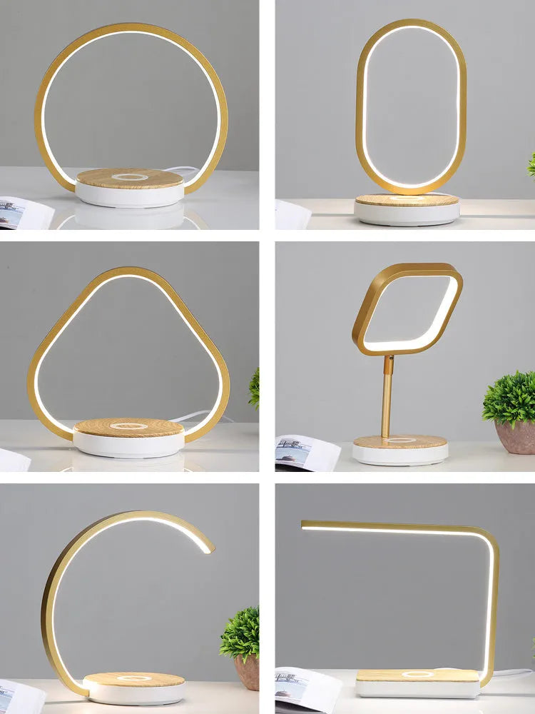 LED desk lamp with wireless charging base in round white finish on a wooden desk