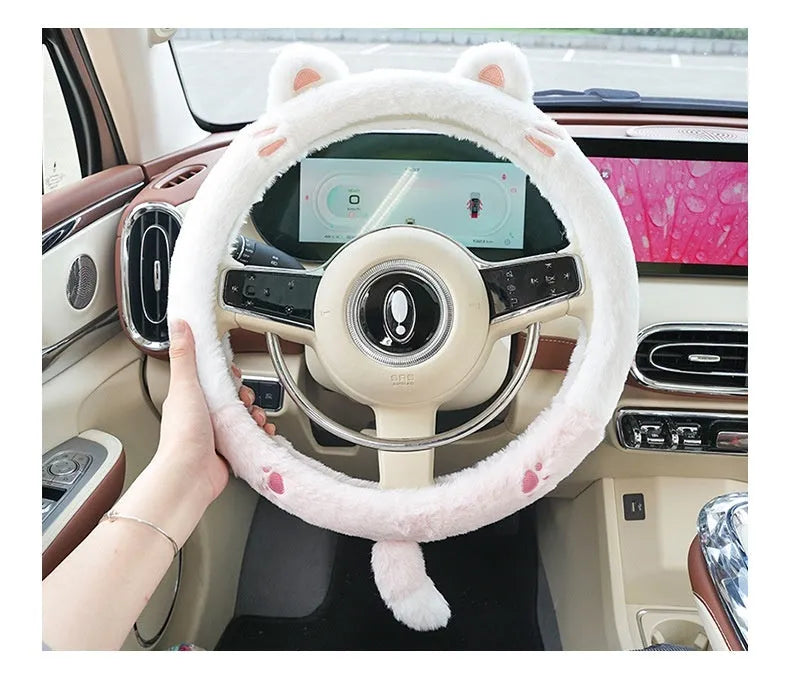 Plush cartoon animal steering wheel cover with embroidery, shown fitted on a car wheel.