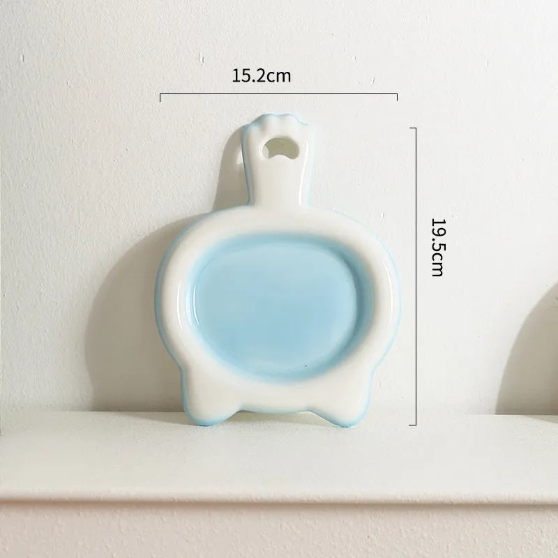 Blue ceramic cat bowl with shallow design for pet food and water
