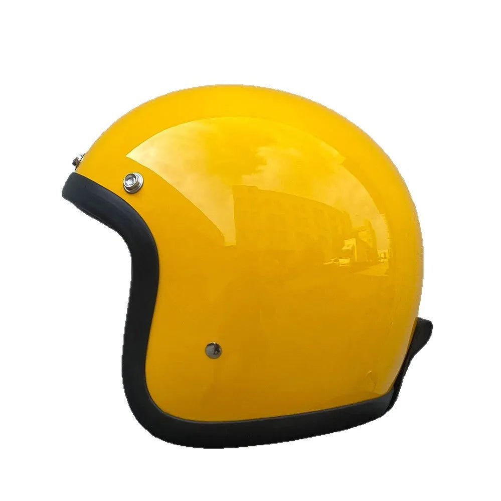Retro-style open-face motorcycle half helmet in cement grey with a glossy FRP shell and quick-release chin strap.