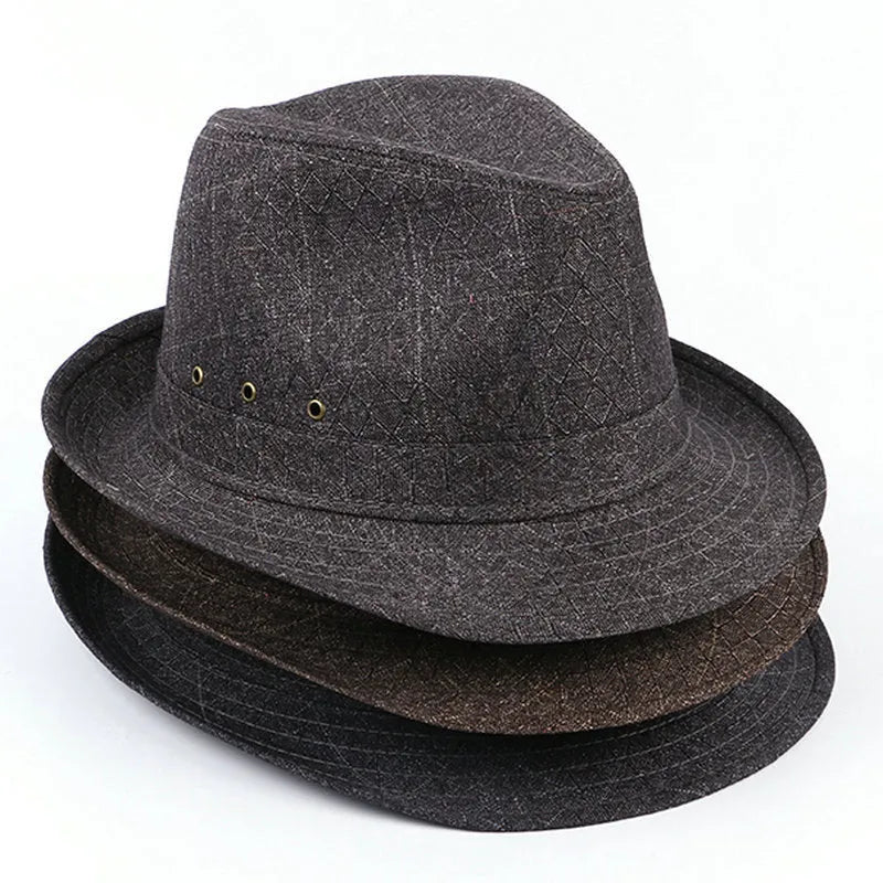 Classic brown fedora hat with pinched crown and 6cm brim, shown on a wooden table.