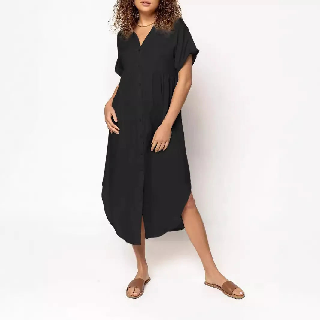 A loose fit, solid colour midi dress with a button front detail, shown in one of eight available colour options.
