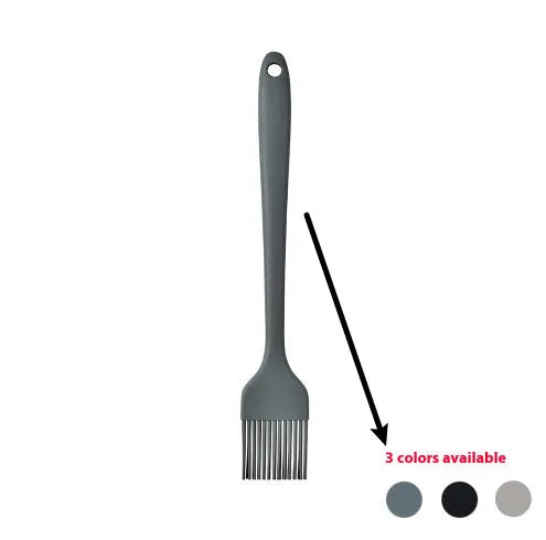 Black silicone kitchen utensil set with 12 tools in a rotating storage bucket on a kitchen countertop
