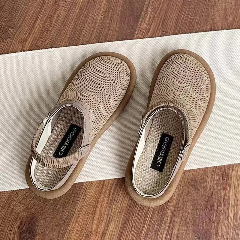Women's beige linen slip-on shoes with mesh lining, round toe, and rubber sole on a neutral background.