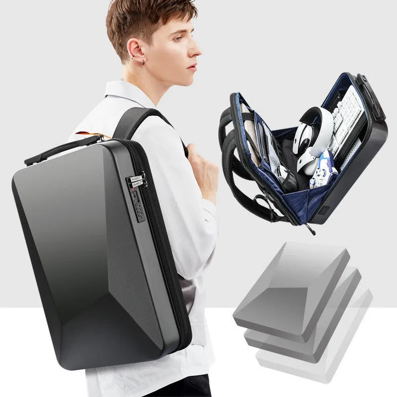 Large men's hard shell backpack in black or silver with a frosted finish, showing laptop compartment and anti-theft lock on the front.