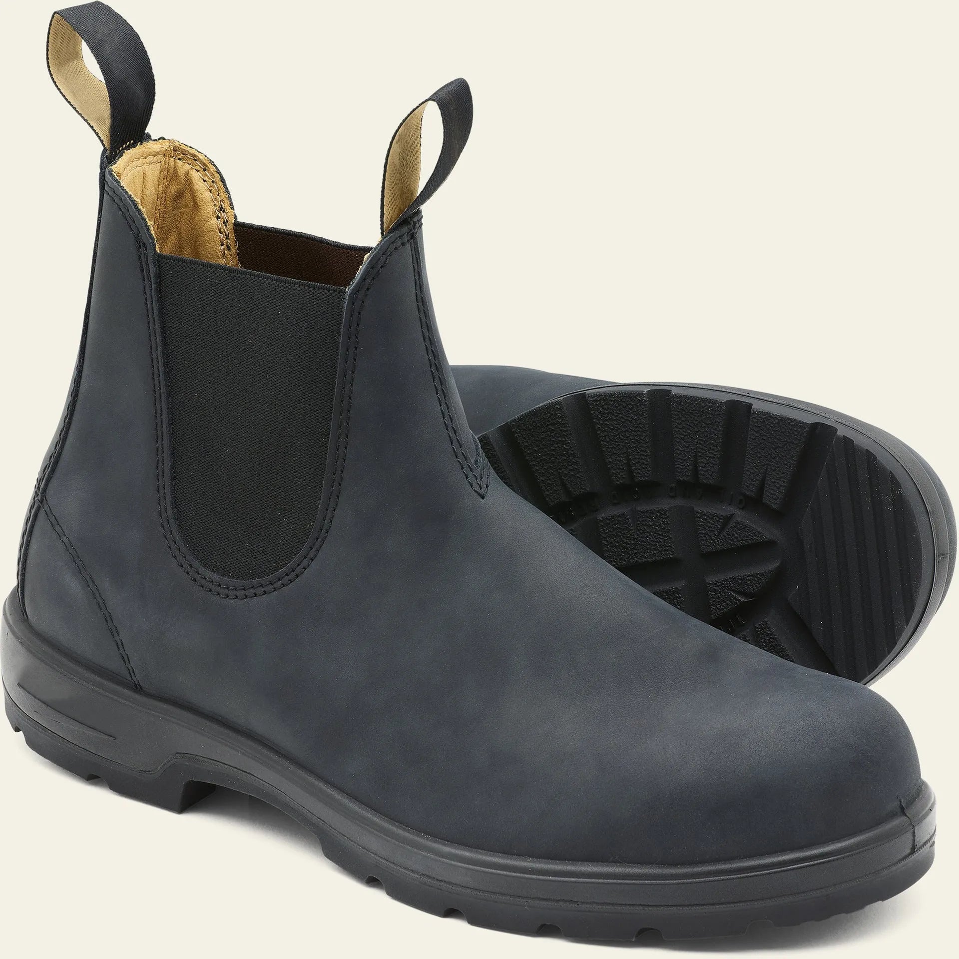 Vintage brown unisex Chelsea boots with frosted finish and a low horseshoe heel on a wooden surface.