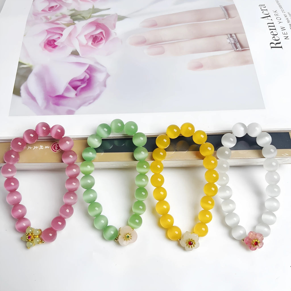 Women's handmade glass beaded bracelet with floral design in yellow, pink, white, or green colours
