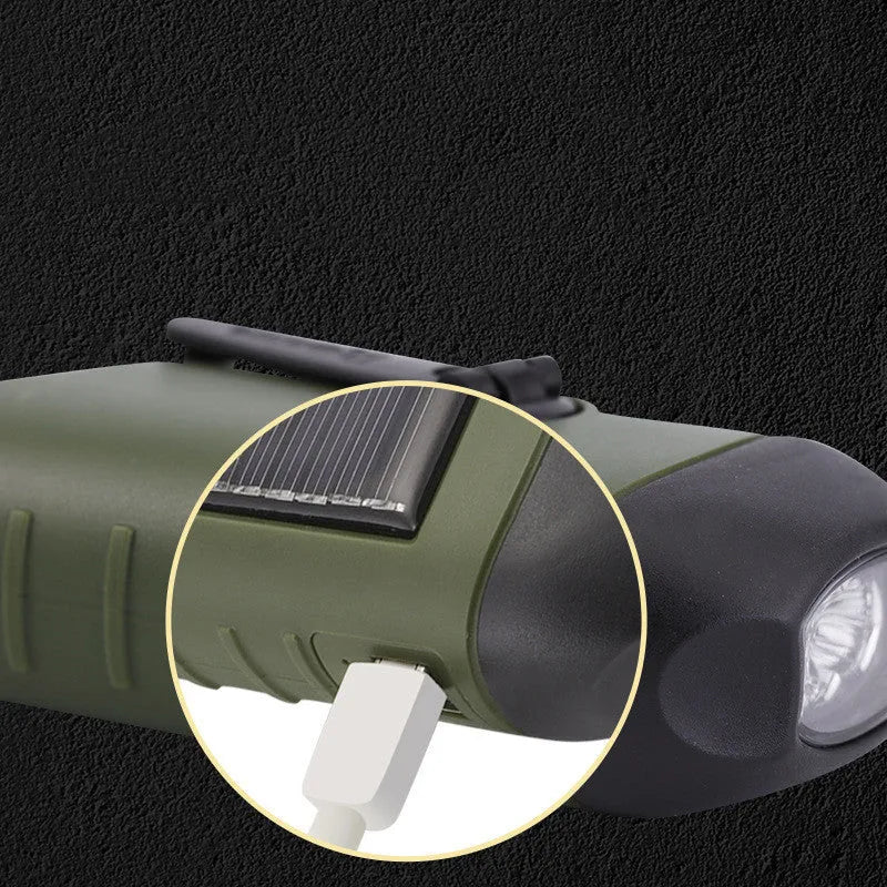 Olive green hand-crank solar LED flashlight with USB charging port on a compact black body.