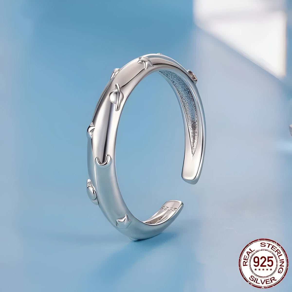 S925 sterling silver planet open ring with polished finish on a woman's finger, BSR692-E colour, adjustable size