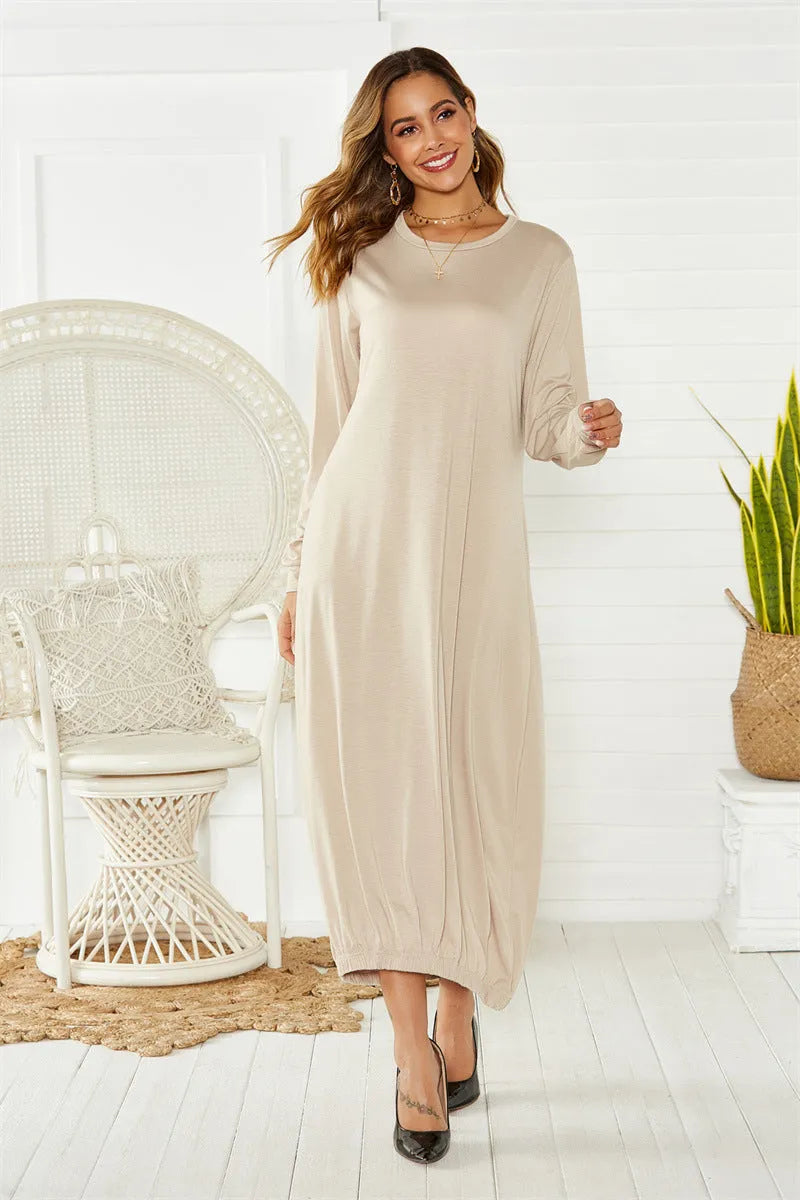 Black lace-up crew neck lantern dress on a hanger, showing loose long fit and threaded detail.