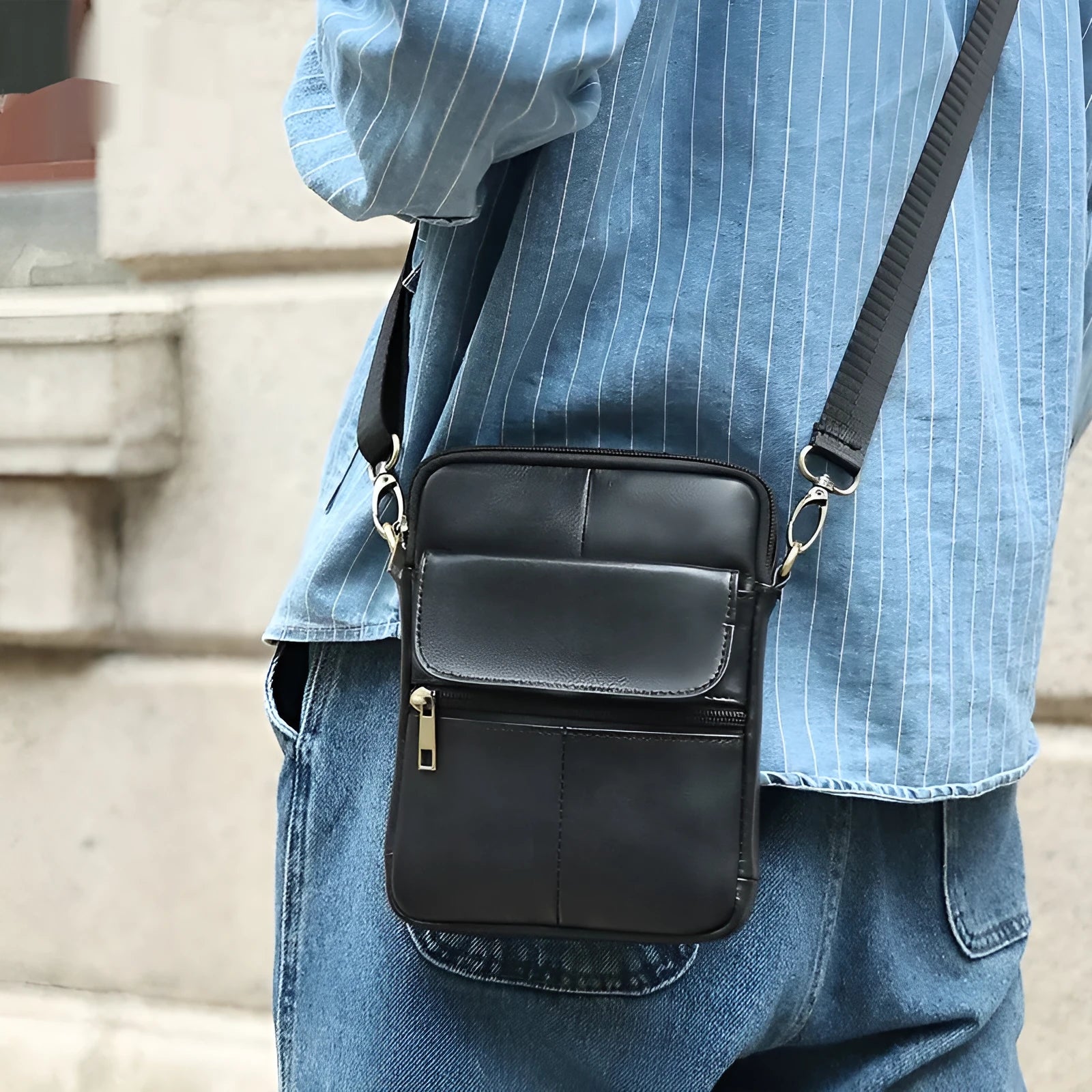 Men's brown leather crossbody shoulder bag with visible stitching and crossbody strap