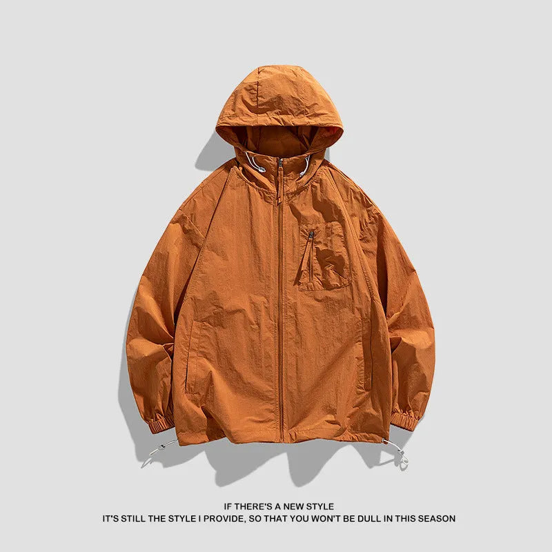 Lightweight beige hooded spandex sun protection jacket for men and women on a hanger.