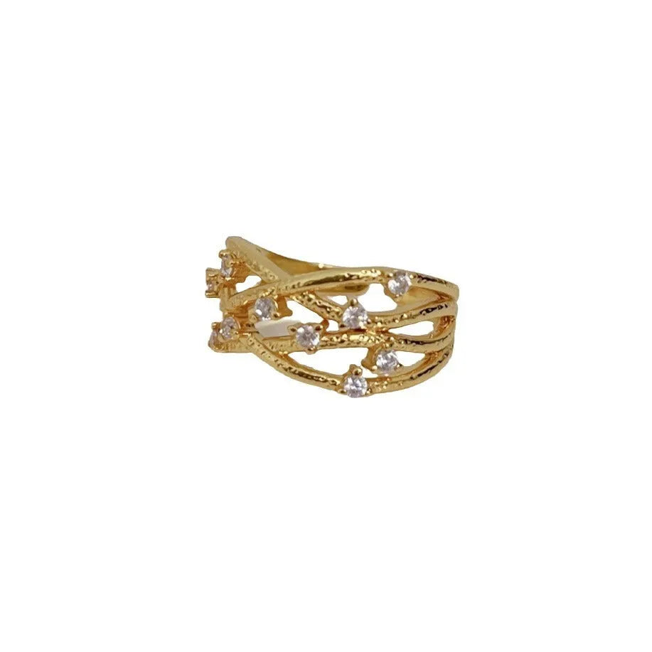 Women's adjustable copper ring with three-dimensional hollow vine cord design in gold electroplated finish