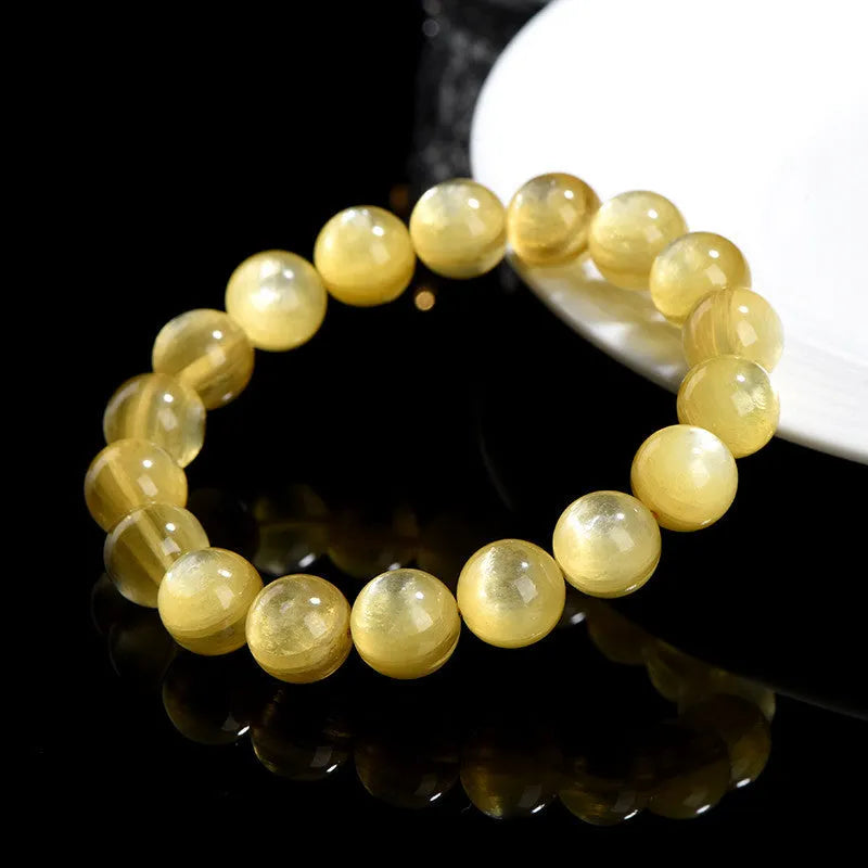 Handmade yellow lepidolite mica bead bracelet with geometric shapes and polished finish