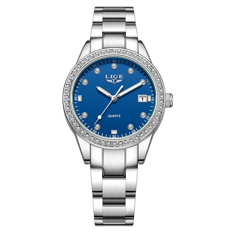 Silver fashion quartz watch with diamond bezel and luminous hands on a 34mm dial.