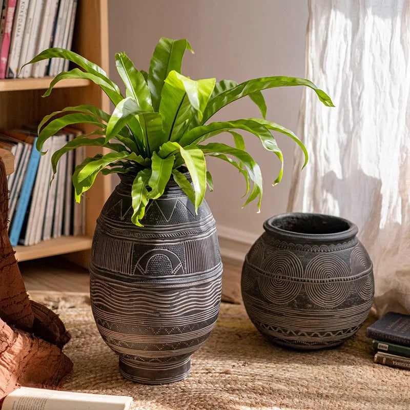 Medium cement flower pot with African ancient tank design and punched drainage base