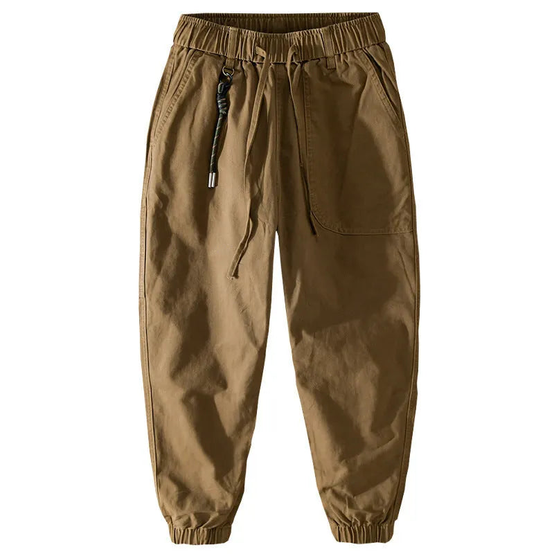 Men's army green cotton drawstring overalls with ankle bands laid flat.