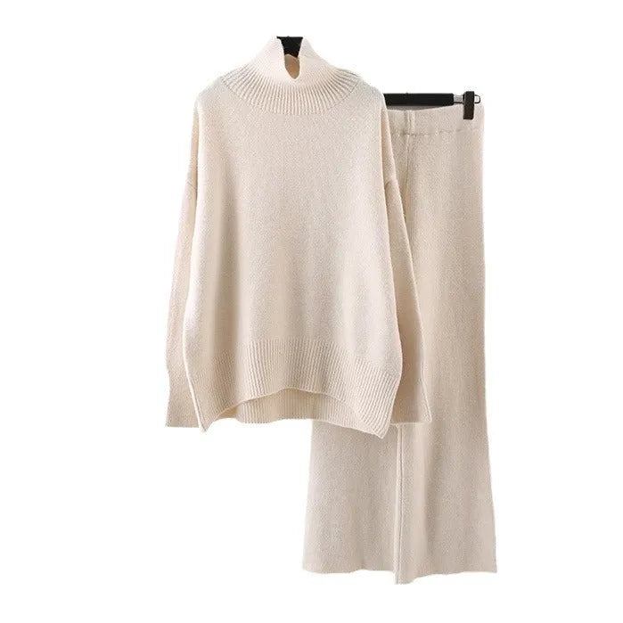 Women's milky white acrylic knit sweater and wide-leg trouser two-piece set on a hanger.