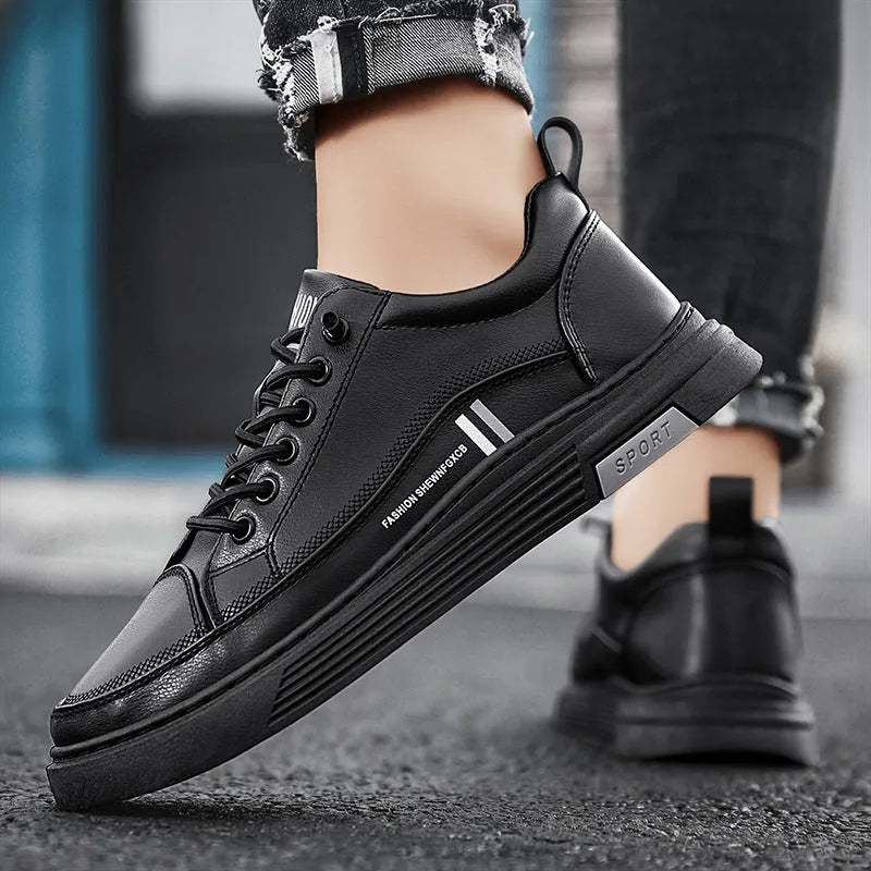 Men's white and black low-top skateboard shoes with an elastic band closure and round toe.