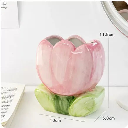 Ceramic pen holder box with floral pattern for desk organisation.