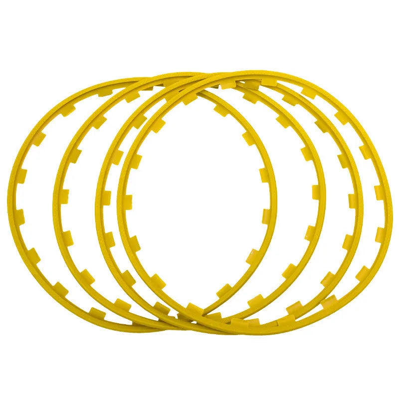 Set of four white nylon wheel hub protection rings for alloy wheels on a grey background.